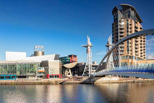 Buildings using roof top solar panels in Manchester in the sun