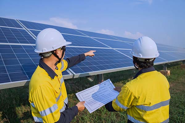 Commercial solar installers Manchester reviewing a business solar panel installation