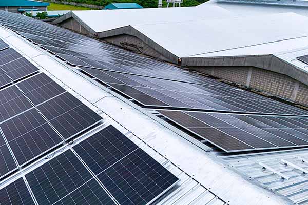Commercial solar panels in Manchester on factory roof